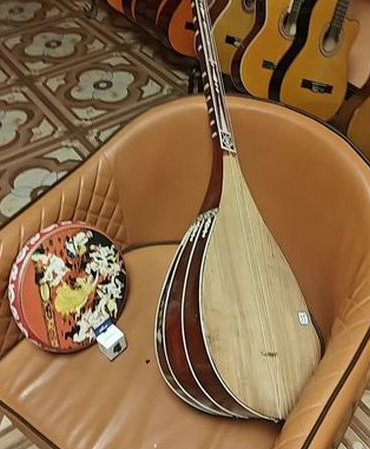 弹布尔与都塔尔:新疆弹拨乐器的双生花